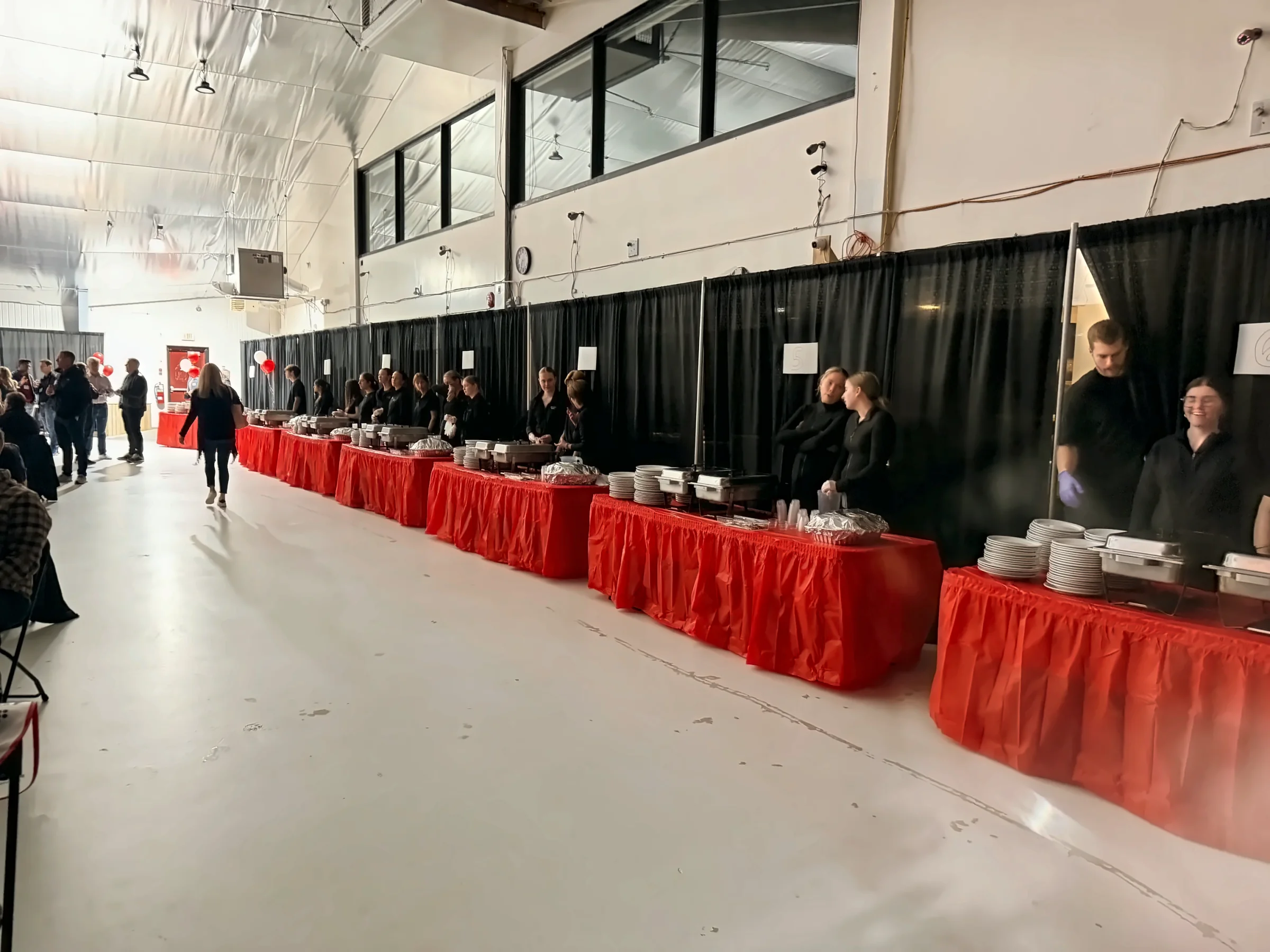 Fireside Catering staff serving a buffet line at a large catered event in St. John's, Newfoundland