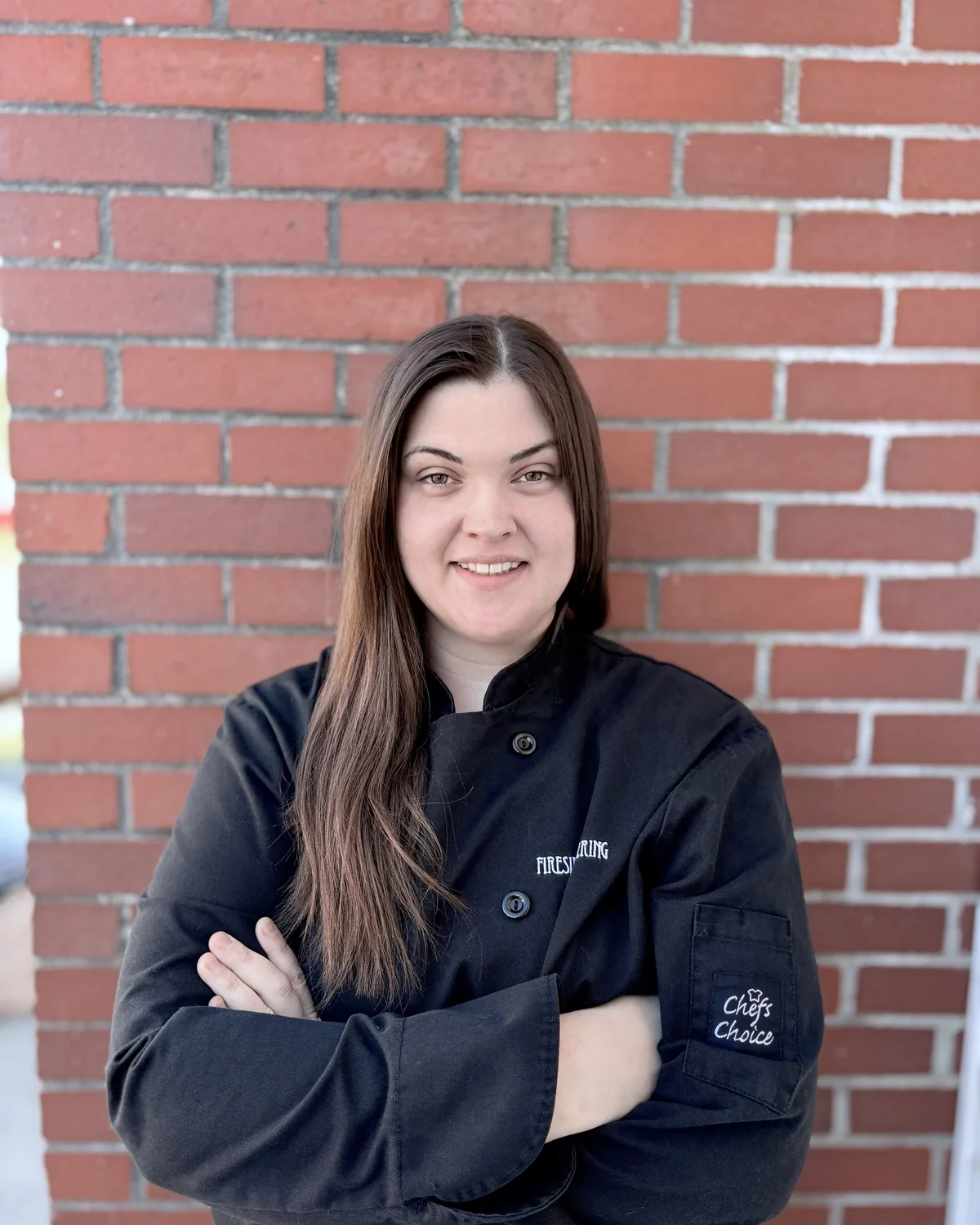 Dakota Hillier, kitchen manager at Fireside Catering, in her Fireside chef's jacket